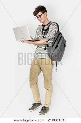 Young man standing using laptop connection