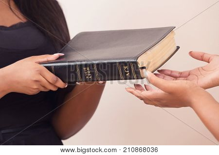 Girl Giving A Bible And Spreading The Good News