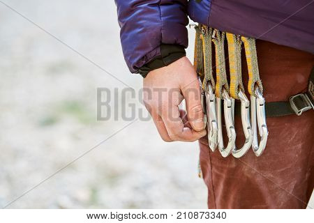 Extreme sport. quick-draws on the climber's harness