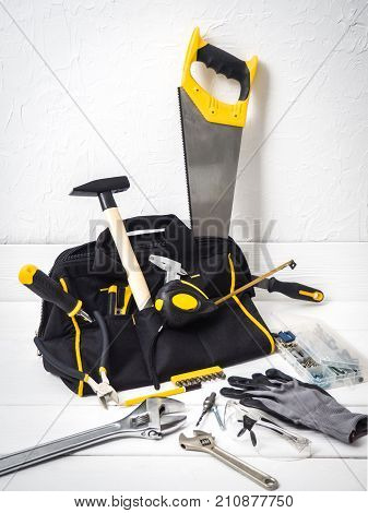 bag with repair tools on white background