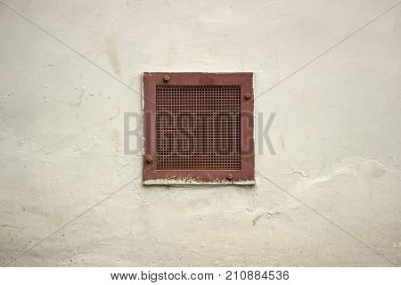 Close up of vent on the white wall. Plastic ventilation grid, piece of home ventilation system.