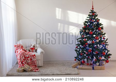 Christmas Tree In A White Room For Christmas With Gifts 2