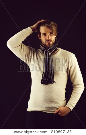 Bearded Macho With Striped Scarf Looking Confidently