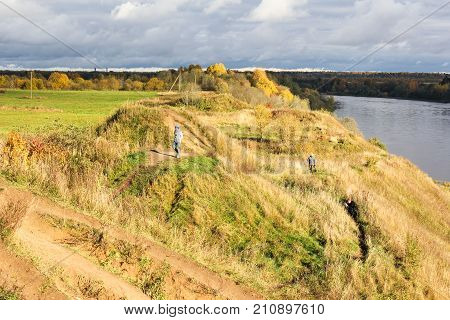 Old Ladoga, Russia - 14 October, People on Klyuchevsky hills, 14 October, 2017.
Bright autumn colors in the provincial cities of Russia.