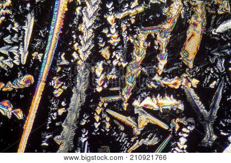 colorful microscopic shot of Sodium nitrate microcrystals in polarized light