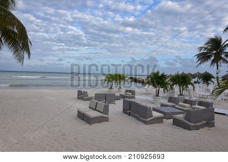 sandy beach with beach chairs for tourists
