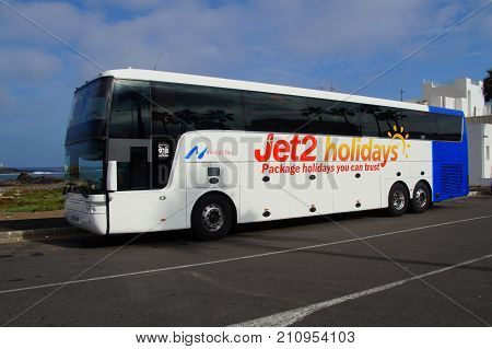 Corralejo, Fuerteventura, Canary Islands, Spain - October 24, 2017: Jet2holidays touring car parked by the side of the road in the city of Corralejo.