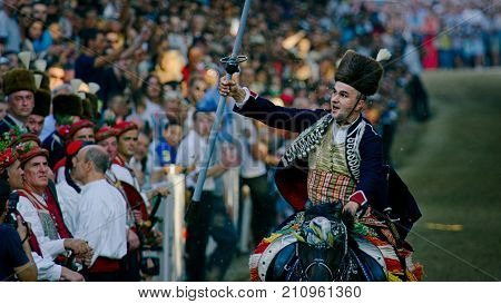 SINJ, CROATIA - August 6, 2017 Alkar Alen Poljak winner of the 302 Alka game hits the highest number of points. Alka knight game is the UNESCO intangible cultural heritage.