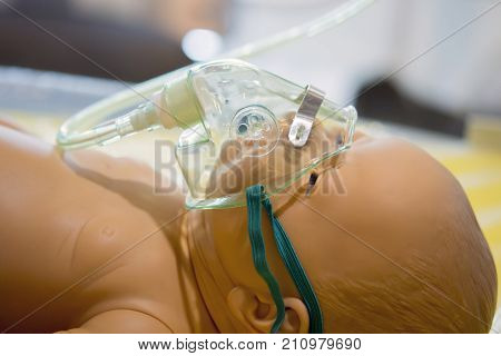 dummy mannequin baby child oxygen mask close-up