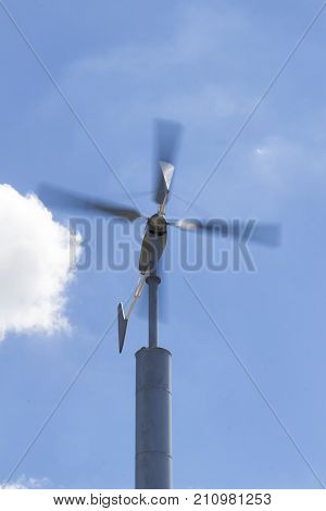 the wind turbines againt blue sky ; selective focus