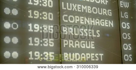 Modern Departures Board With Detail On European Cities Destinations Typed In Illuminated Letters At 
