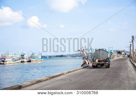 Fisherman Boat And Transportation In Seafood Industry At Seashore