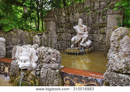 Salzburg, Austria - May 25, 2019 : Trick Fountains And Sculptures At The  Public Gardens Of Hellbrun