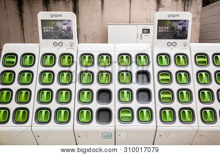 Taipei, Taiwan - June 7th, 2019: charging station for battery packs of Taiwan-based Gogoro electronic motocycle at street in Taipei, Taiwan, Asia