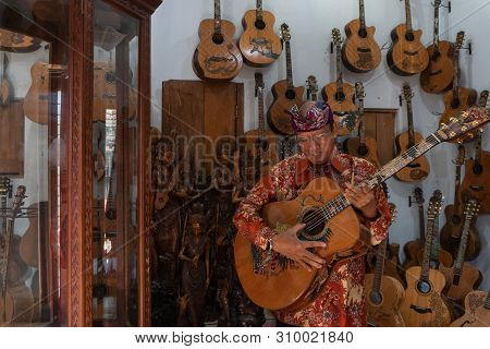 Gianyar,bali/indonesia-may 30 2019: I Wayan Tuges, The Owner Of The Tuges And Blueberry Carving Guit