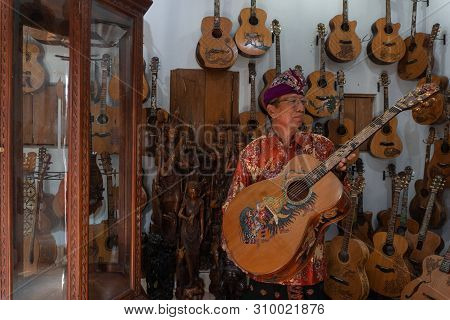 Gianyar,bali/indonesia-may 30 2019: I Wayan Tuges, The Owner Of The Tuges And Blueberry Carving Guit