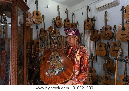 Gianyar,bali/indonesia-may 30 2019: I Wayan Tuges, The Owner Of The Tuges And Blueberry Carving Guit