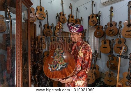 Gianyar,bali/indonesia-may 30 2019: I Wayan Tuges, The Owner Of The Tuges And Blueberry Carving Guit
