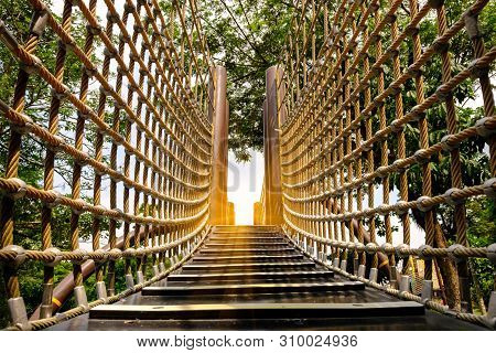 Wooden Bridge With Strong Robe At Playground Perspective