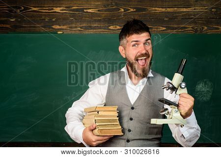 Education, Research, Knowledge, Technology. Happy Male Teacher Holds Microscope. Student Doing Resea