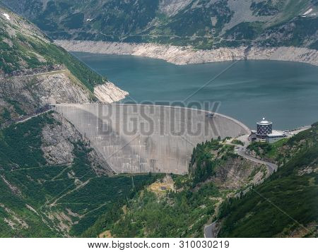 Dam And Reservoir Of A Hydroelectric Powerplant In Stunning Alpine Landscape - Maltastaudamm And Kol