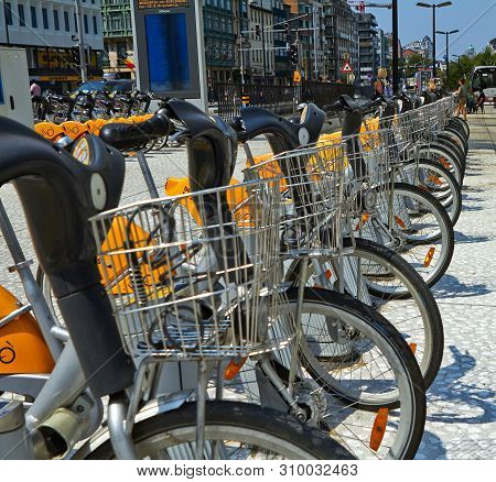 Brussels, Belgium - July 25, 2018. Villo Bicycles Parked In The Bicycle Sharing Station On Street. P