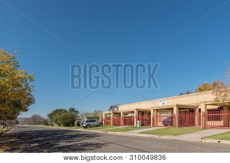 Vrede, South Africa - May 1, 2019: A Street Scene, With Apartments, Houses And Vehicles, In Vrede, I