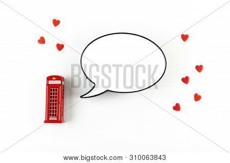 Flat Lay With London Phonebooth And Light Box In Form Of Speech Bubble With Copy Space For Text. Tra