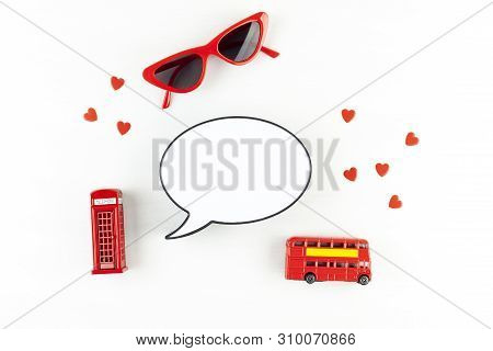 Flat Lay With London Phonebooth And Light Box In Form Of Speech Bubble With Copy Space For Text. Tra