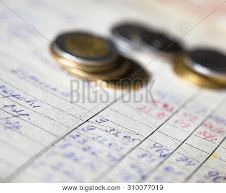 Hand-written Calculations And Coins. Bookkeeping (accounting). Economy. Financial Themes. Money Savi