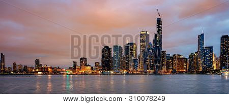 Panoramic View Of Chicago City High Rise Buildings Cloudy Sky In The Evening