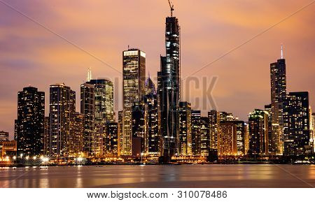 Panoramic View Of Chicago City High Rise Buildings Cloudy Sky In The Evening