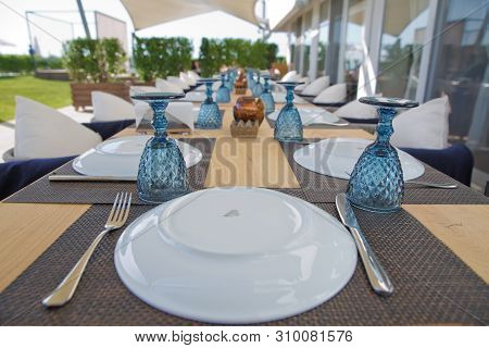 Luxury Dinning Room With Wooden Table At Home .table Setting At Restaurant .elegant Table Set Up For