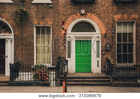Dublin, Ireland - November 8, 2018: Traditional Irish House. Old Building Exterior, Colorful Brick W