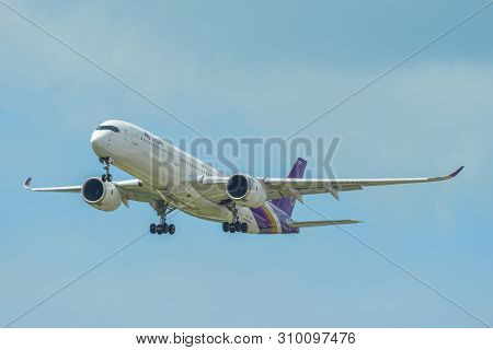 Airplane Landing At Singapore Airport