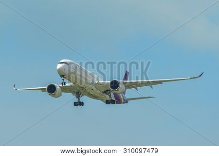 Airplane Landing At Singapore Airport