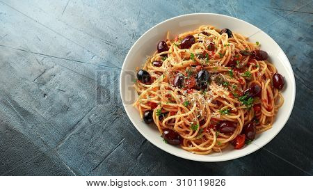 Pasta Alla Puttanesca With Garlic, Olives, Capers, Tomato And Anchois Fish