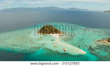Aerial Seascape Tropical Island And Sand Beach, Turquoise Water And Coral Reef. Malacory Island, Phi