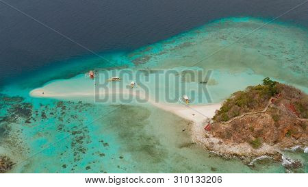 Aerial Seascape Tropical Island And Sand Beach, Turquoise Water And Coral Reef. Malacory Island, Phi
