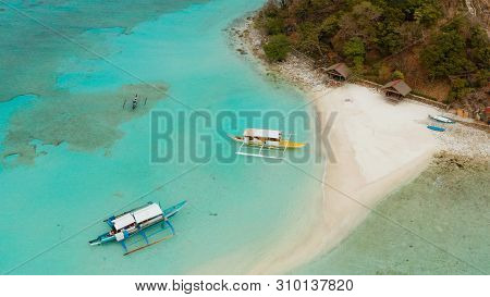 Aerial Seascape Tropical Island And Sand Beach, Turquoise Water And Coral Reef. Malacory Island, Phi