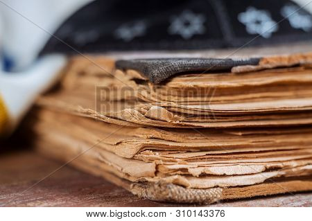 Jewish Religion Prayer Book With Kippah On Wooden Background.
