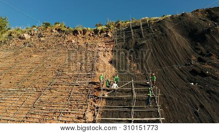 Protection Of Road From Mountain Slough, Rockfall With Metal Accumulative Restraining Net Fences. Wo