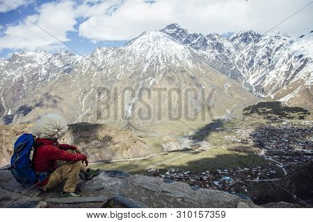 View At Young Hiker With Traditional Papakha Fur Hat At High Latitude Mountains At Mtskheta-mtianeti