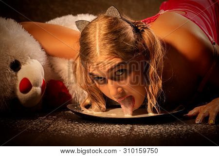 Girl In Lingerie Laps Milk From Bowl On Floor