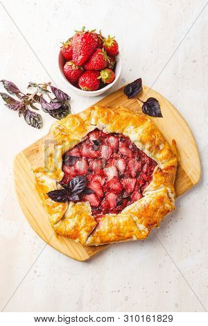 Homemade Strawberry Open Pie Gallet With Purple Basil And Balsamic Dressing On A Light Background. T