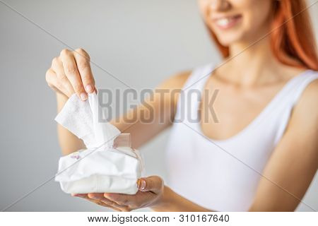 Wet Wipes: Women Take One Wipe From Package For Cleaning