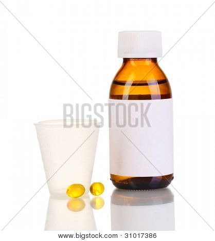 Bottiglia medica con jigger e compresse isolate on white
