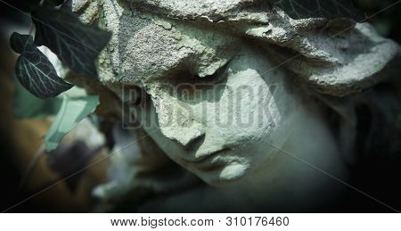 Death. Ancient Statue Of Sad Angel Of Death As Symbol Of Human Pain, Fear And End Of Life.
