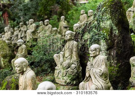 groups of buddhist arhat stone statue in the garden