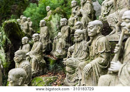 groups of buddhist arhat stone statue in the garden